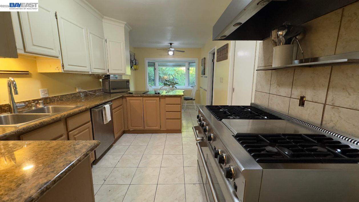 190 Alderwood Road Walnut Creek, CA 94598 - Photo 8 of 29 a kitchen with a sink stove and cabinets