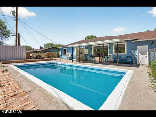 1910 California Avenue Reno, NV 89509 - Photo 5 of 5 a view of a house with a swimming pool