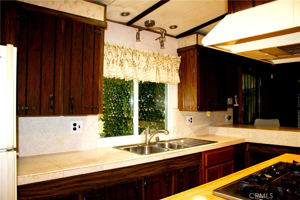 17700 South Avalon, Unit 411 Carson, CA 90746 - Photo 17 of 39 a bathroom with a sink and a large mirror