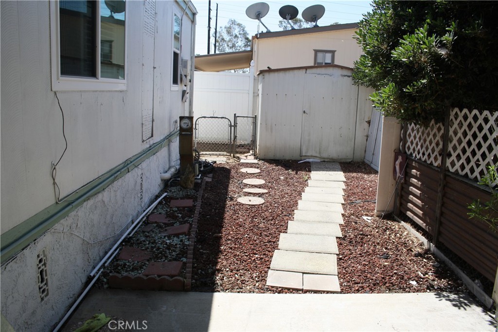 17700 South Avalon, Unit 411 Carson, CA 90746 - Photo 6 of 39 a pathway of a house with a yard