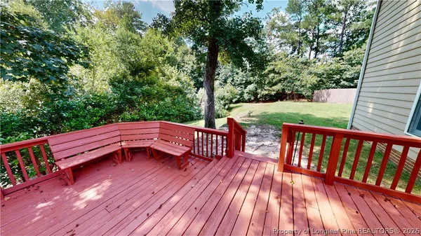 a view of deck with two chairs and wooden floor