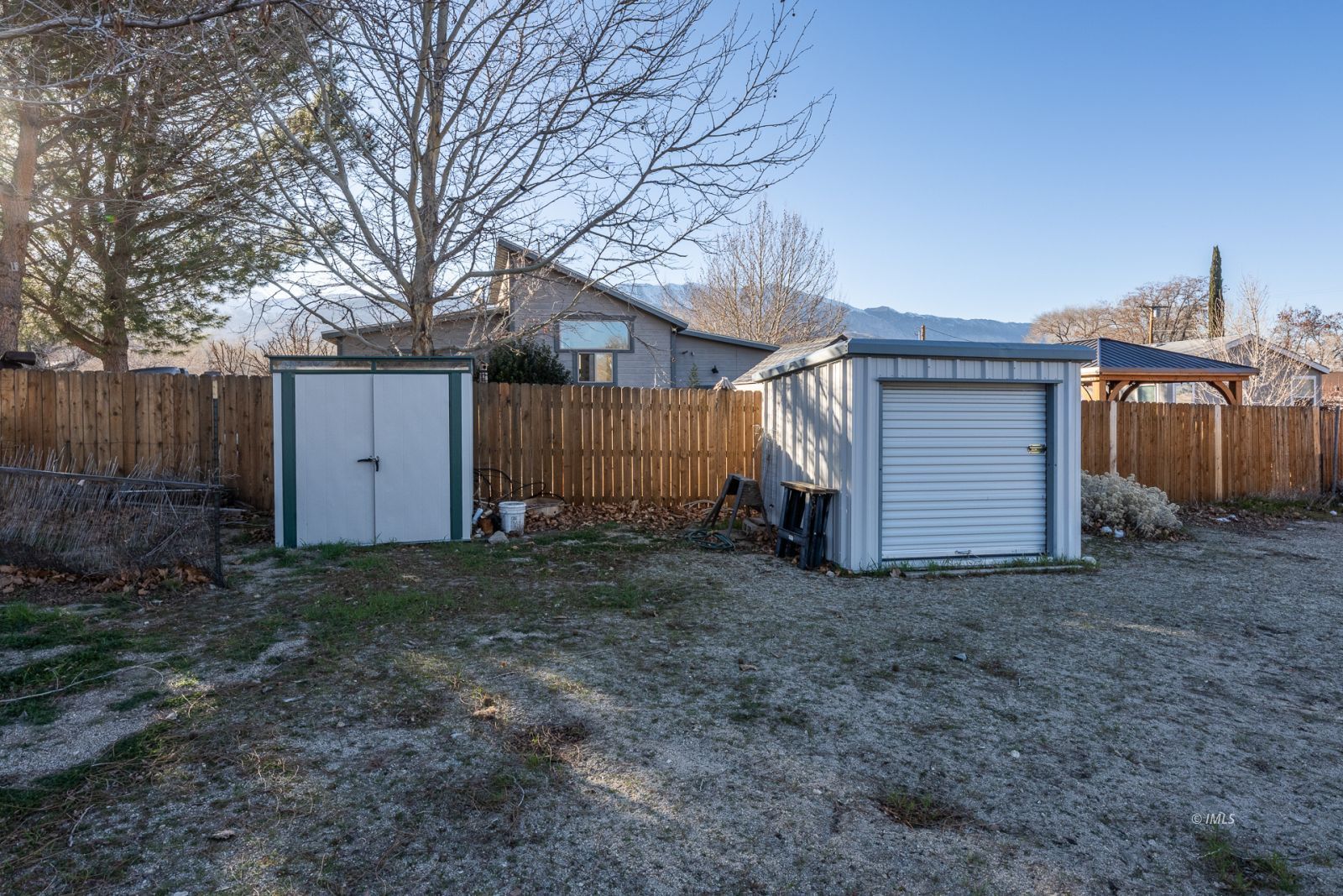 231 West Street Big Pine, CA 93513 - Photo 22 of 23 a view of a house with a yard and garage