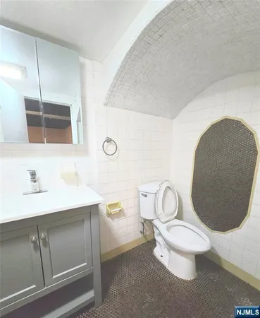 a bathroom with a sink a mirror and a shower