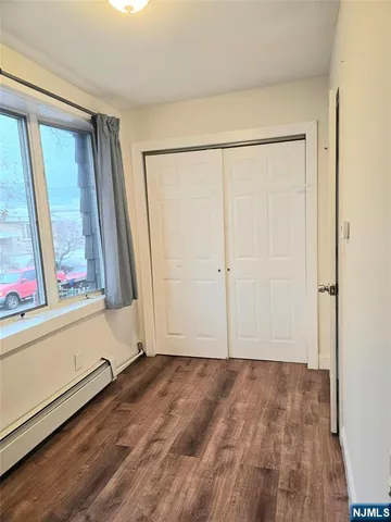 a view of front door with wooden floor