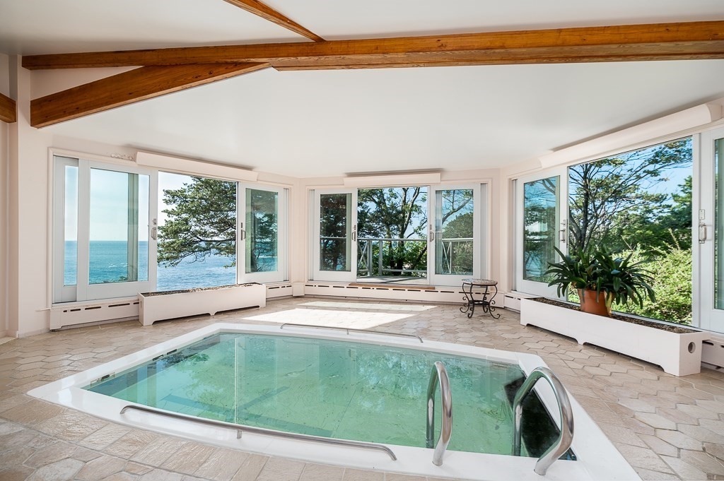 9 Eaglehead Road Manchester, MA 01944 - Photo 12 of 42 a swimming pool with outdoor seating and yard