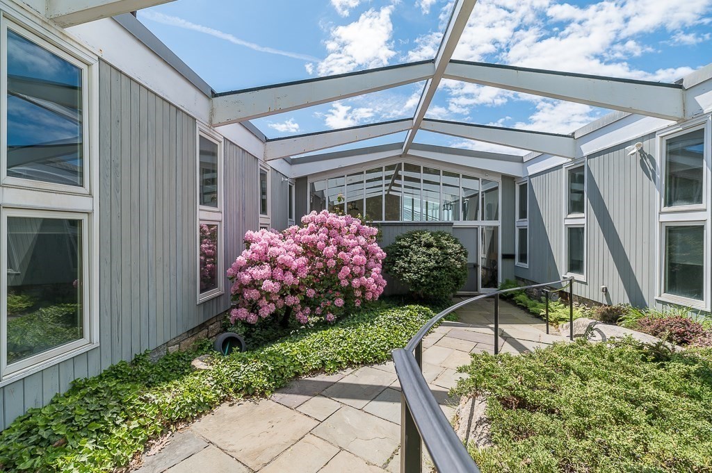 9 Eaglehead Road Manchester, MA 01944 - Photo 32 of 42 a front view of a house with garden