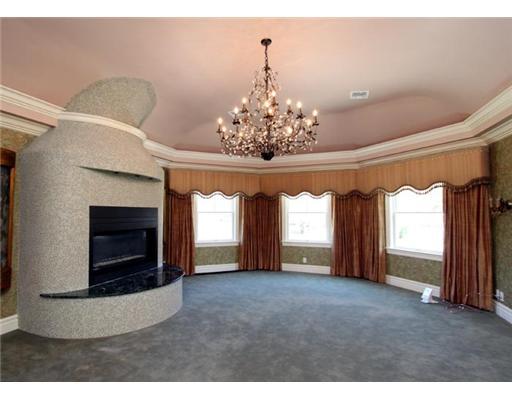 423 Stanwich Road Greenwich, CT 06830 - Photo 7 of 9 a view of a fireplace and window in the room