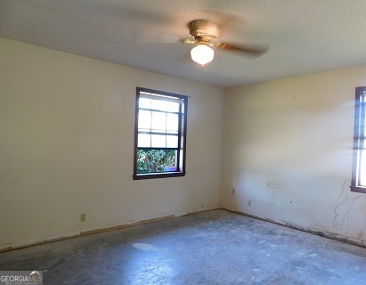 563 Keith Road Guyton, GA 31312 - Photo 12 of 13 an empty room with windows and fan