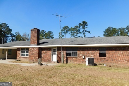 563 Keith Road Guyton, GA 31312 - Photo 2 of 13 a front view of a house with a yard and garage