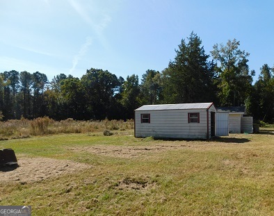 563 Keith Road Guyton, GA 31312 - Photo 3 of 13 a view of backyard with green space