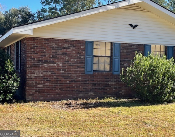 563 Keith Road Guyton, GA 31312 - Photo 4 of 13 a front view of a house with a yard
