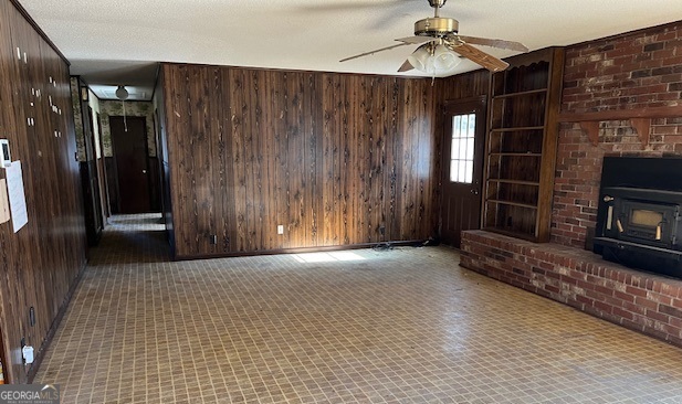 563 Keith Road Guyton, GA 31312 - Photo 5 of 13 a view of a livingroom with wooden floor a fireplace and window