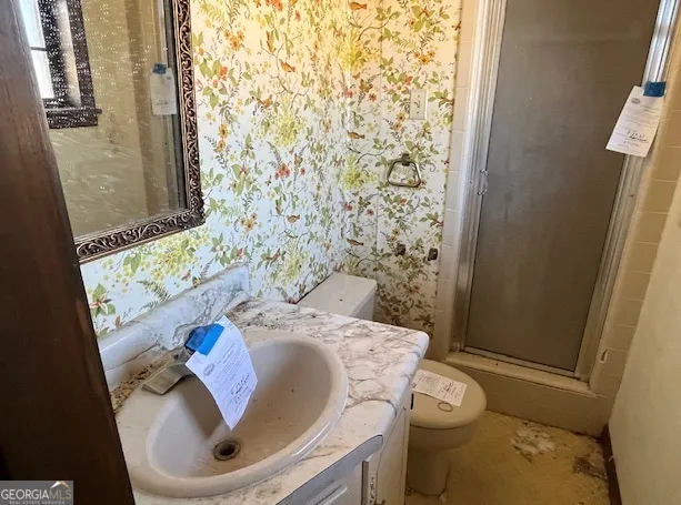 a bathroom with a sink and a toilet