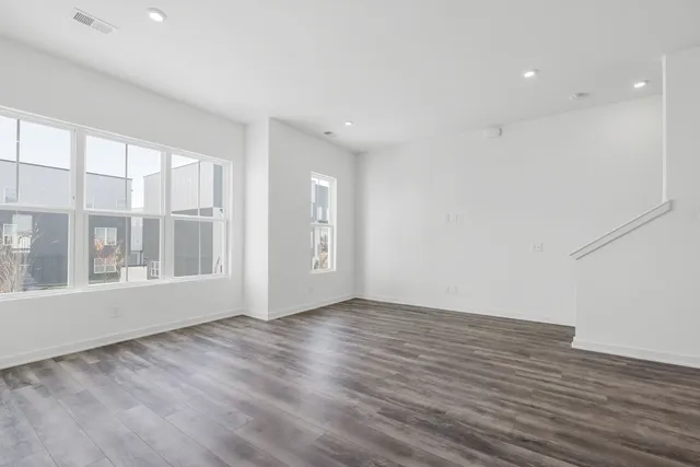 a view of a balcony with wooden floor