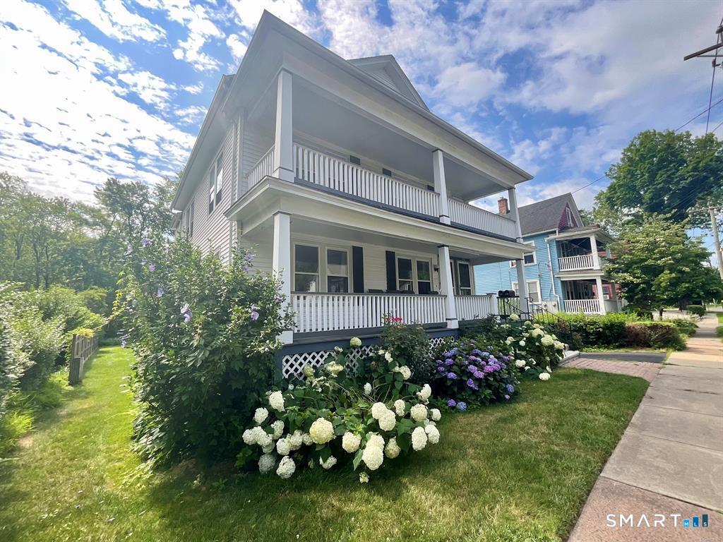 238 Broad Street Wethersfield, CT 06109 - Photo 1 of 1 a front view of a house with a garden