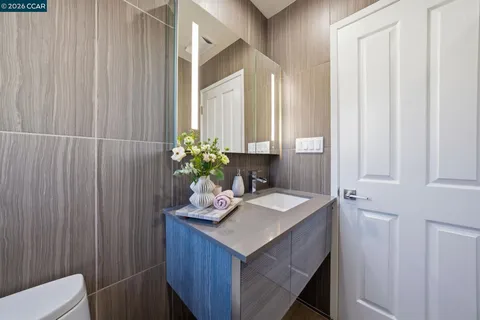 a bathroom with a toilet a sink and tub