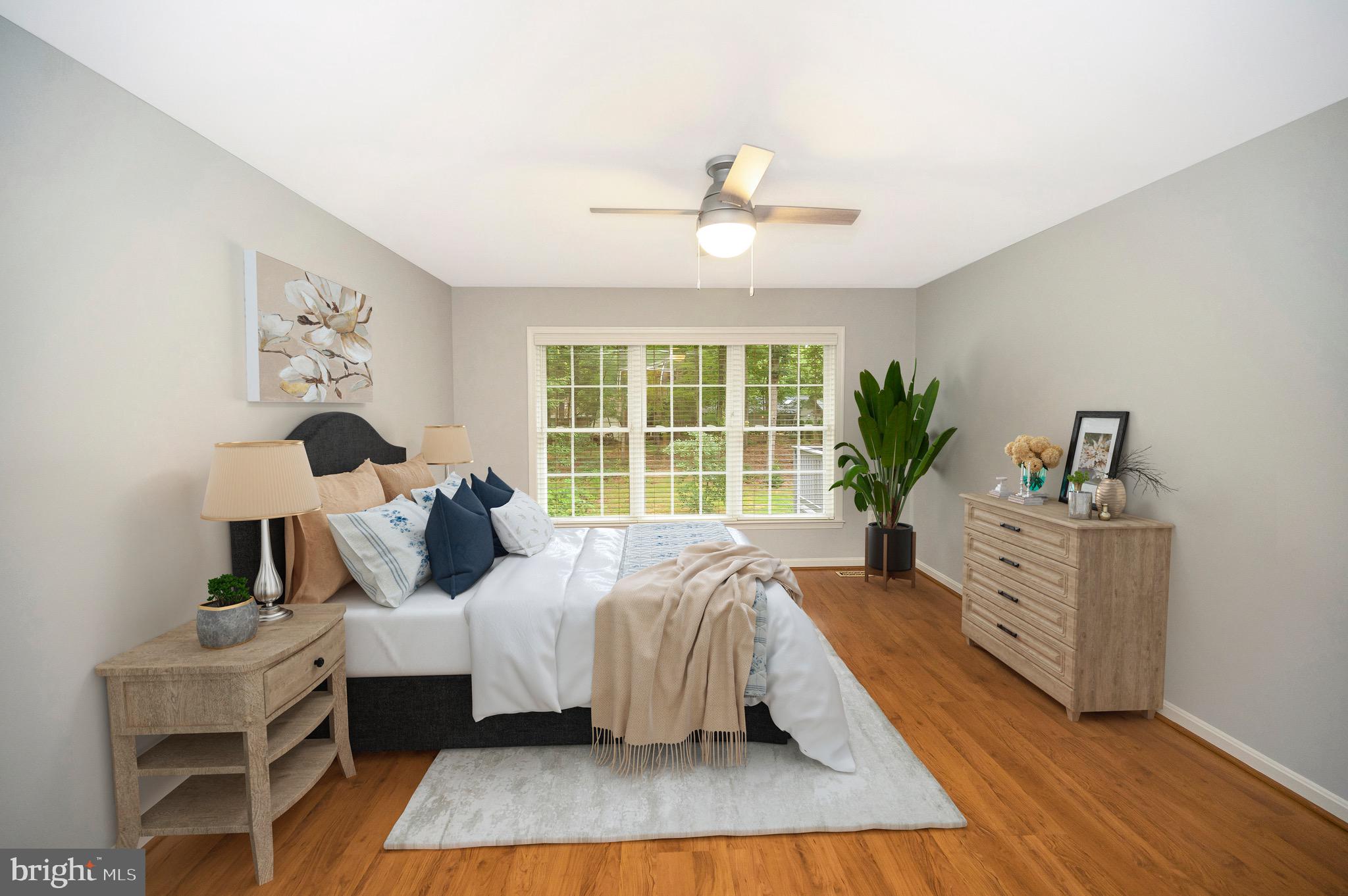 502 Monticello Circle Locust Grove, VA 22508 - Photo 17 of 45 a bed room with a bed and a large window