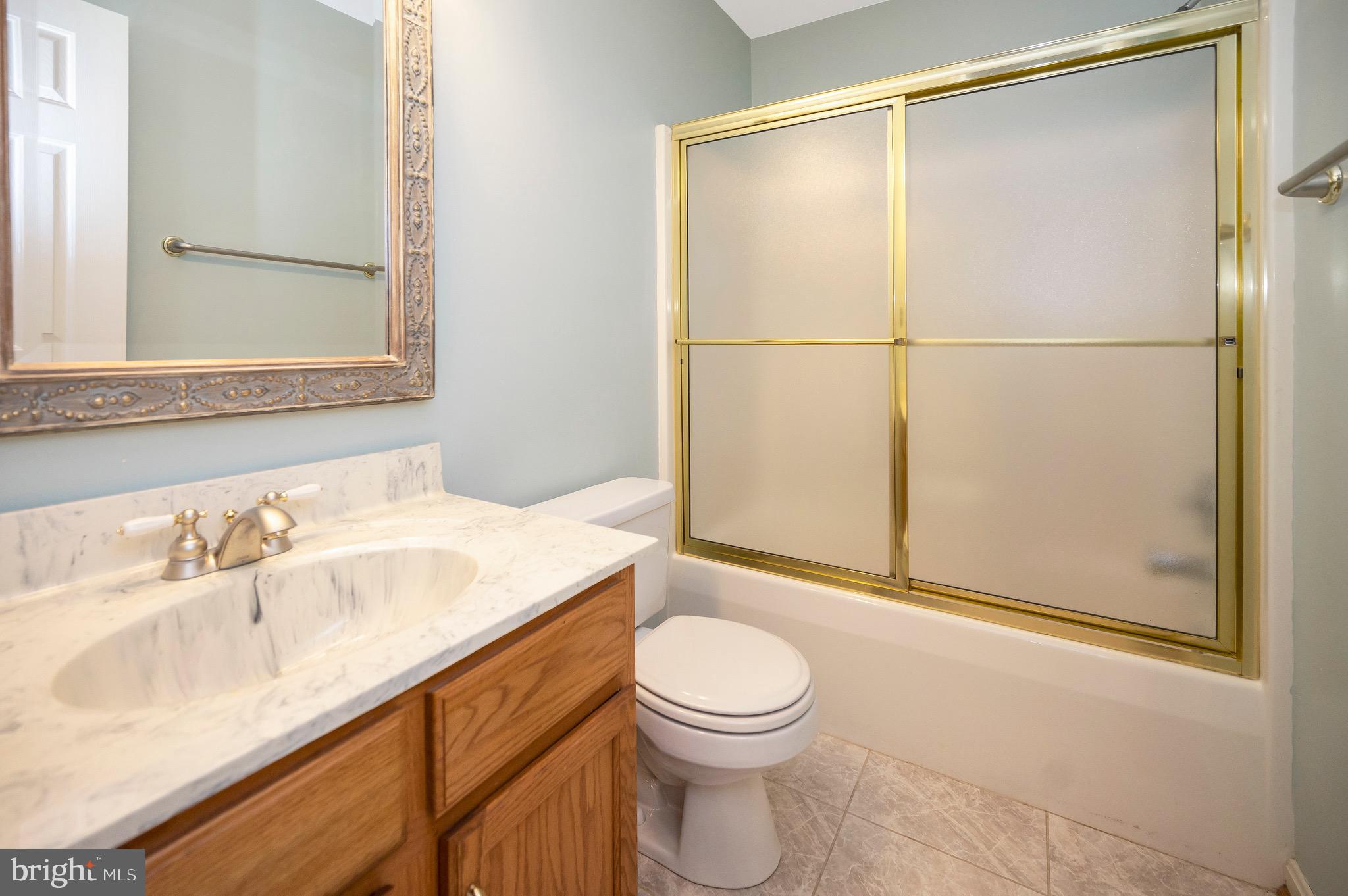 502 Monticello Circle Locust Grove, VA 22508 - Photo 23 of 45 a bathroom with a sink a toilet and shower