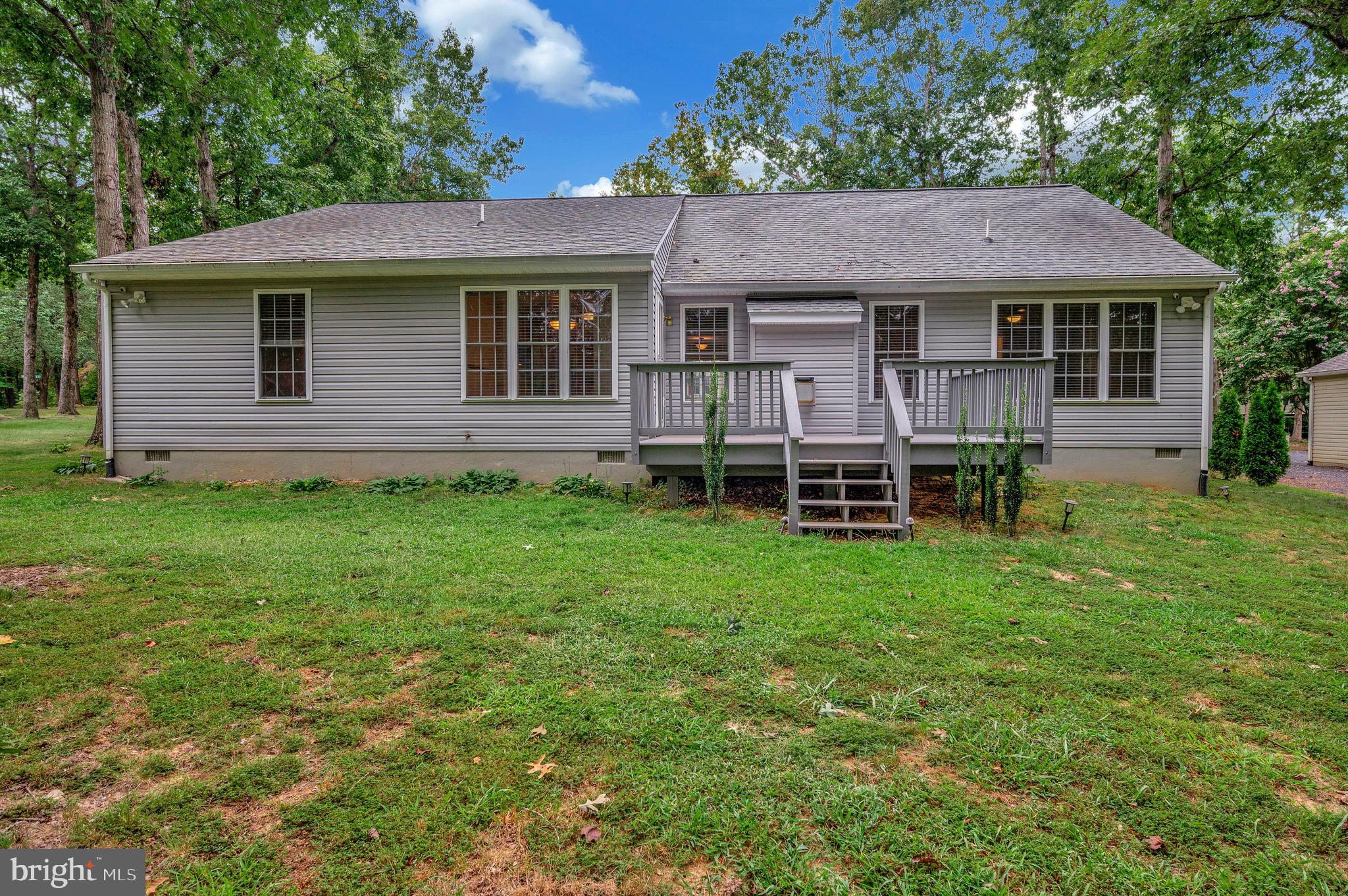 502 Monticello Circle Locust Grove, VA 22508 - Photo 26 of 45 a view of a house with a yard and sitting area