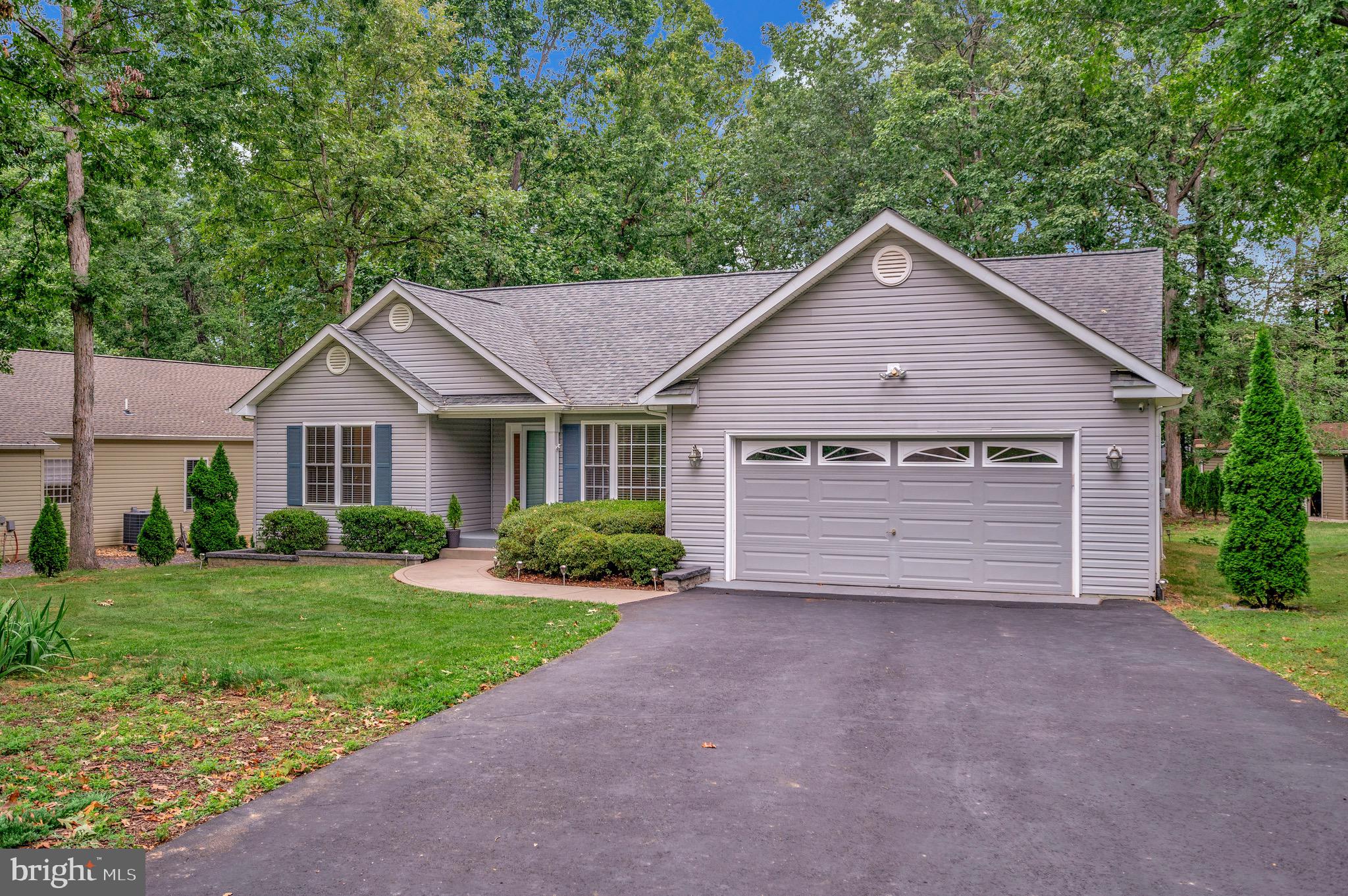 502 Monticello Circle Locust Grove, VA 22508 - Photo 28 of 45 a view of a house with a yard and large tree