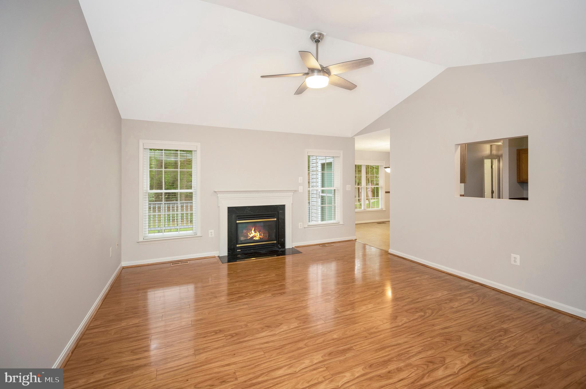 502 Monticello Circle Locust Grove, VA 22508 - Photo 6 of 45 a view of an empty room with wooden floor and a window