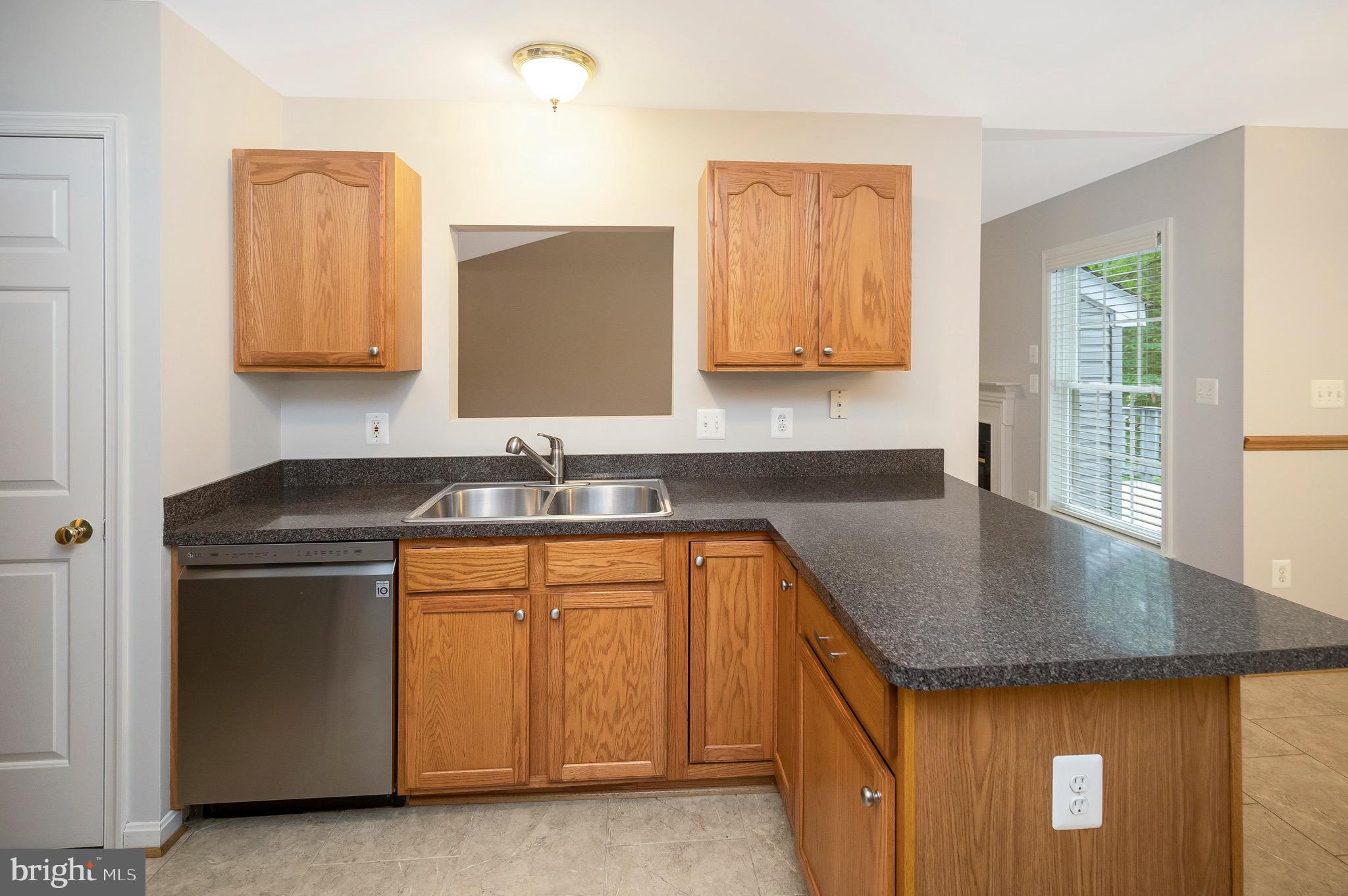 502 Monticello Circle Locust Grove, VA 22508 - Photo 10 of 45 a kitchen with stainless steel appliances granite countertop a sink and a refrigerator