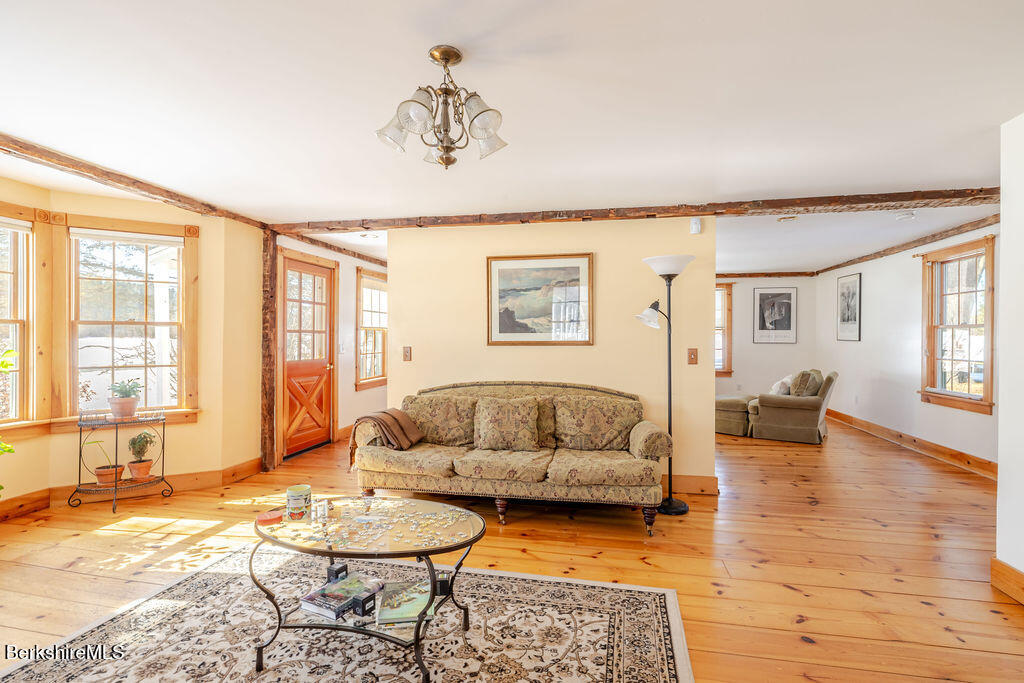 54 Egremont Plain Road Great Barrington, MA 01230 - Photo 11 of 48 a living room with furniture and a table