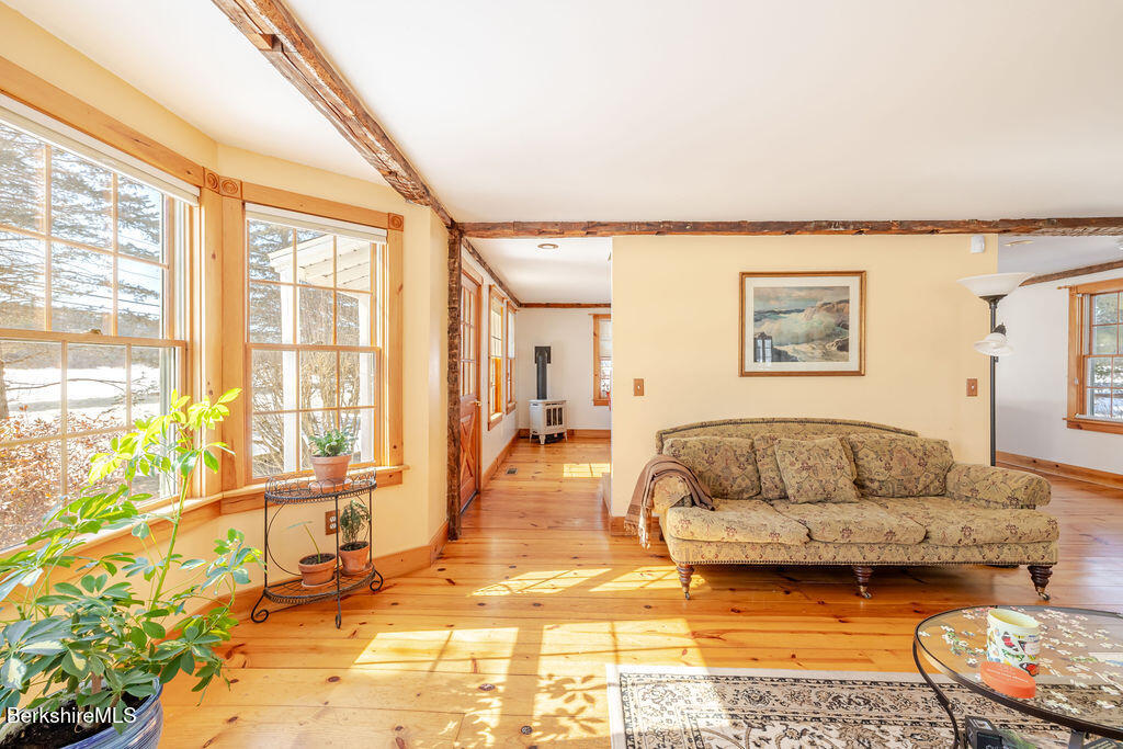 54 Egremont Plain Road Great Barrington, MA 01230 - Photo 13 of 48 a bedroom with furniture and a large window