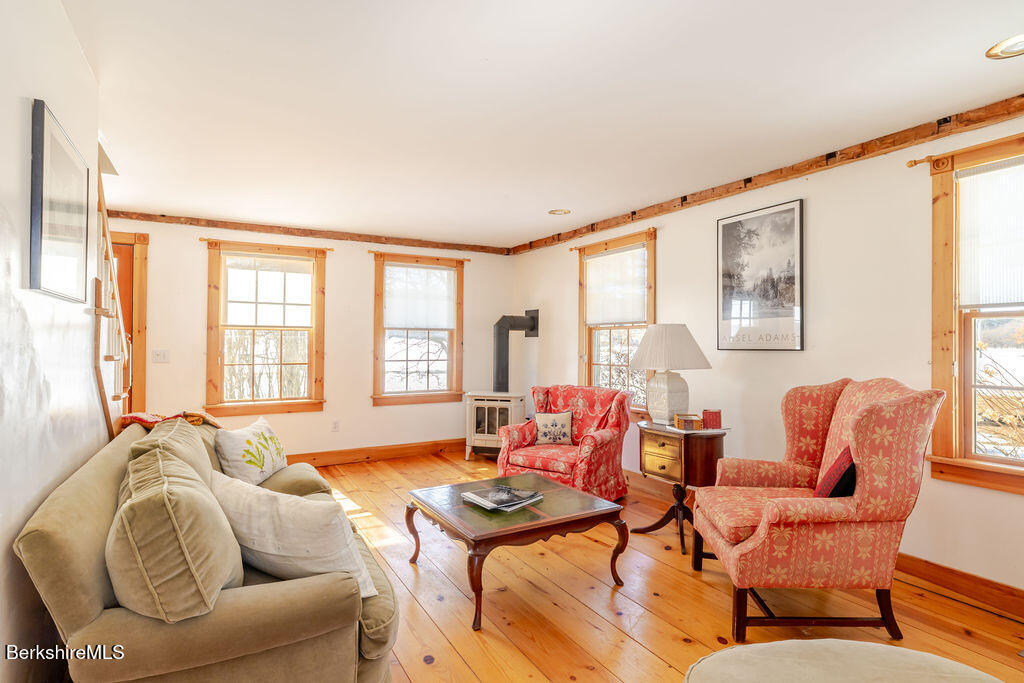 54 Egremont Plain Road Great Barrington, MA 01230 - Photo 14 of 48 a living room with furniture and floor to ceiling windows