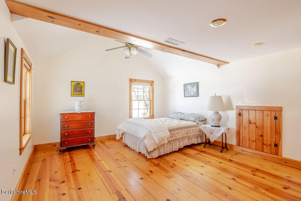 54 Egremont Plain Road Great Barrington, MA 01230 - Photo 21 of 48 a bedroom with a bed and wooden floor