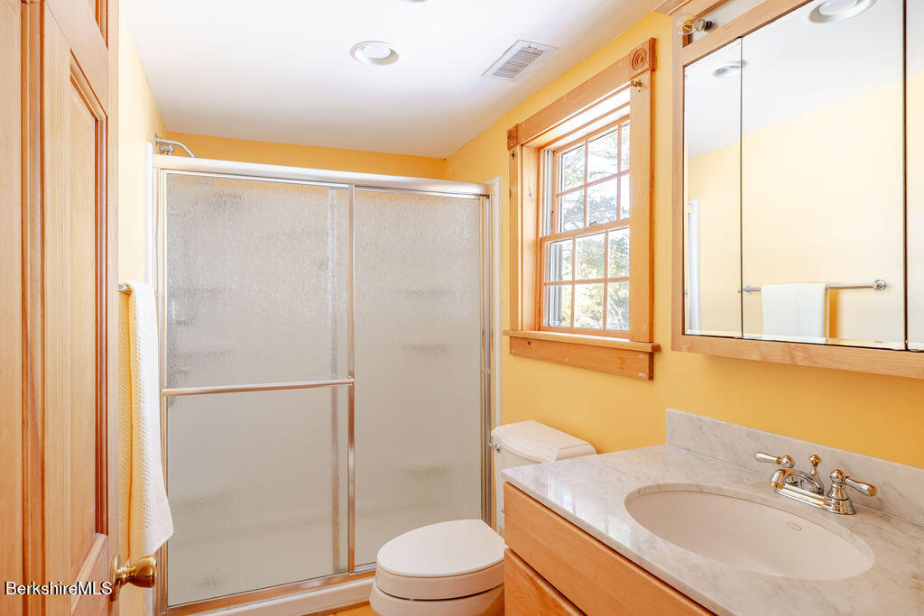 54 Egremont Plain Road Great Barrington, MA 01230 - Photo 25 of 48 a bathroom with a sink toilet and shower