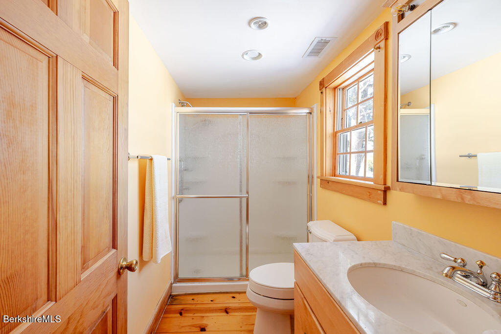 54 Egremont Plain Road Great Barrington, MA 01230 - Photo 26 of 48 a bathroom with a sink toilet and shower