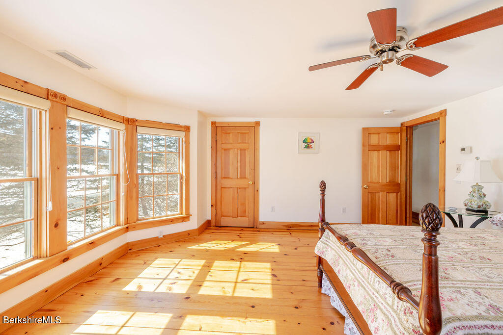 54 Egremont Plain Road Great Barrington, MA 01230 - Photo 31 of 48 a bedroom with a bed and a large window