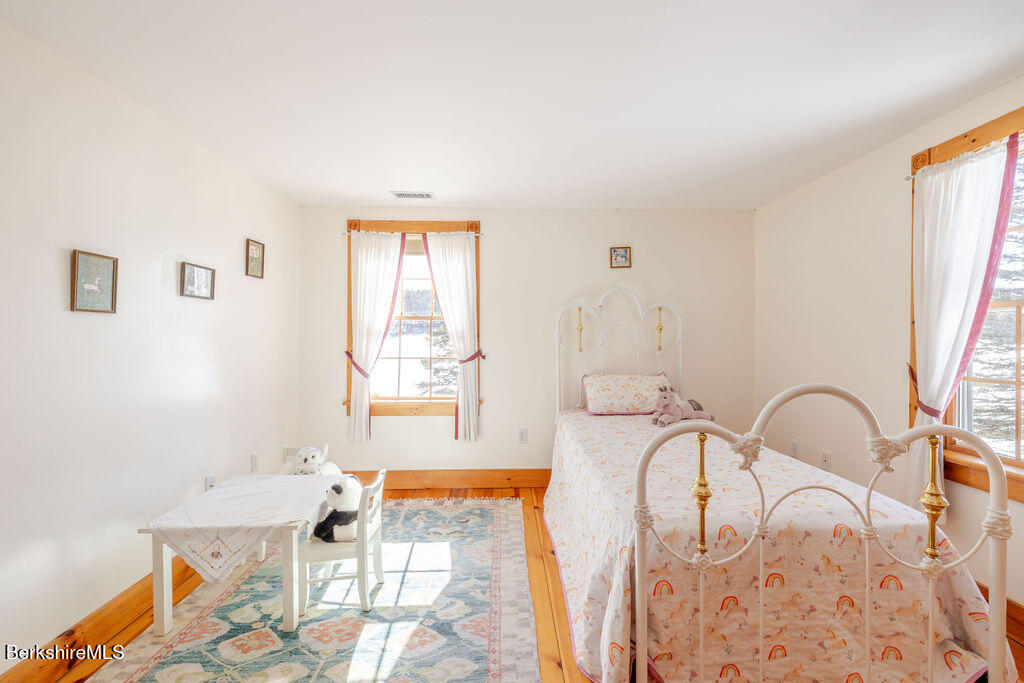 54 Egremont Plain Road Great Barrington, MA 01230 - Photo 34 of 48 a bedroom with a bed and a large window