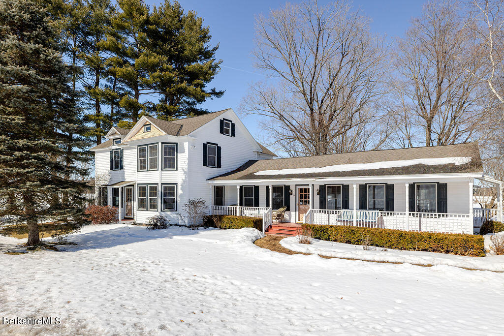 54 Egremont Plain Road Great Barrington, MA 01230 - Photo 40 of 48 a view of a white house with a large tree in front of it