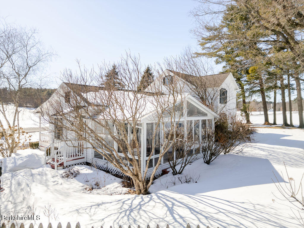 54 Egremont Plain Road Great Barrington, MA 01230 - Photo 42 of 48 a view of a house with a yard covered in snow