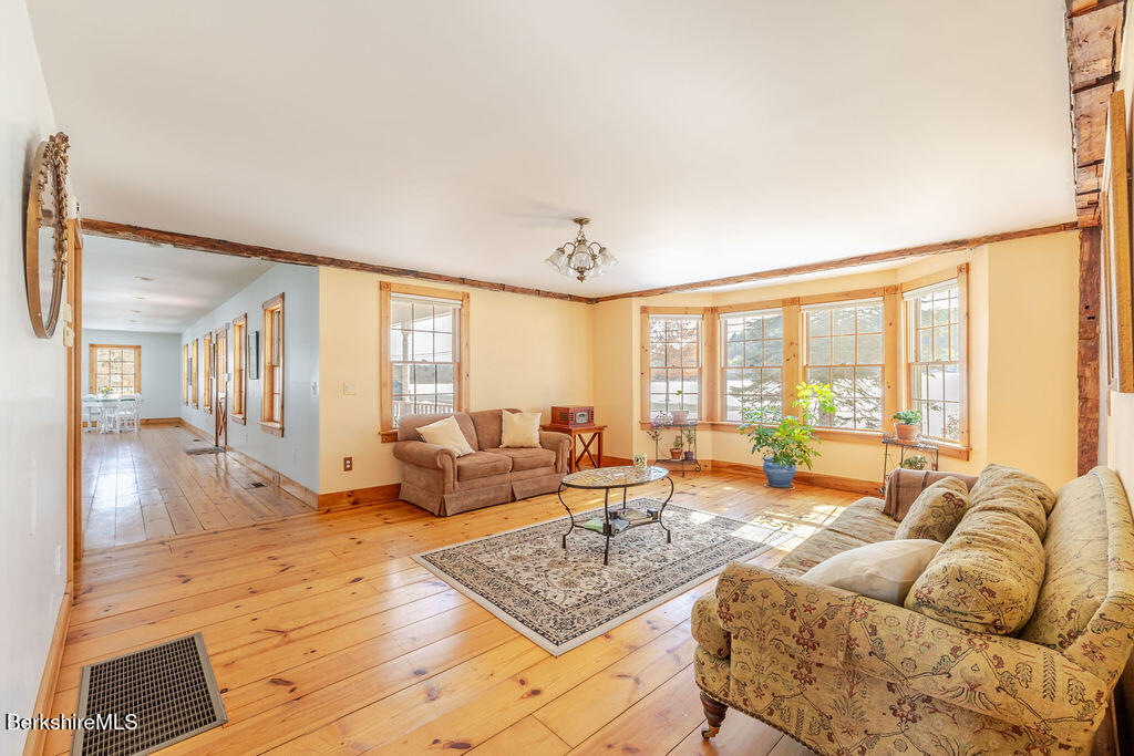 54 Egremont Plain Road Great Barrington, MA 01230 - Photo 10 of 48 a living room with furniture and large windows