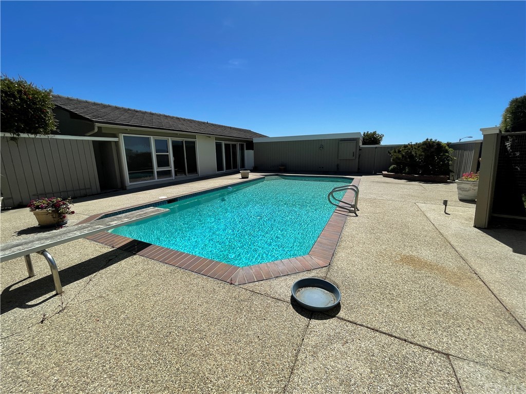 32592 Balearic Dana Point, CA 92629 - Photo 17 of 26 a backyard of a house with table and chairs