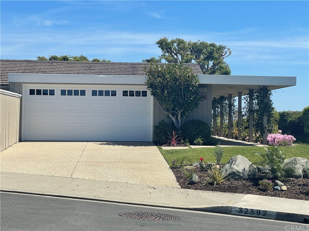 32592 Balearic Dana Point, CA 92629 - Photo 3 of 26 a view of a house with a yard and potted plants