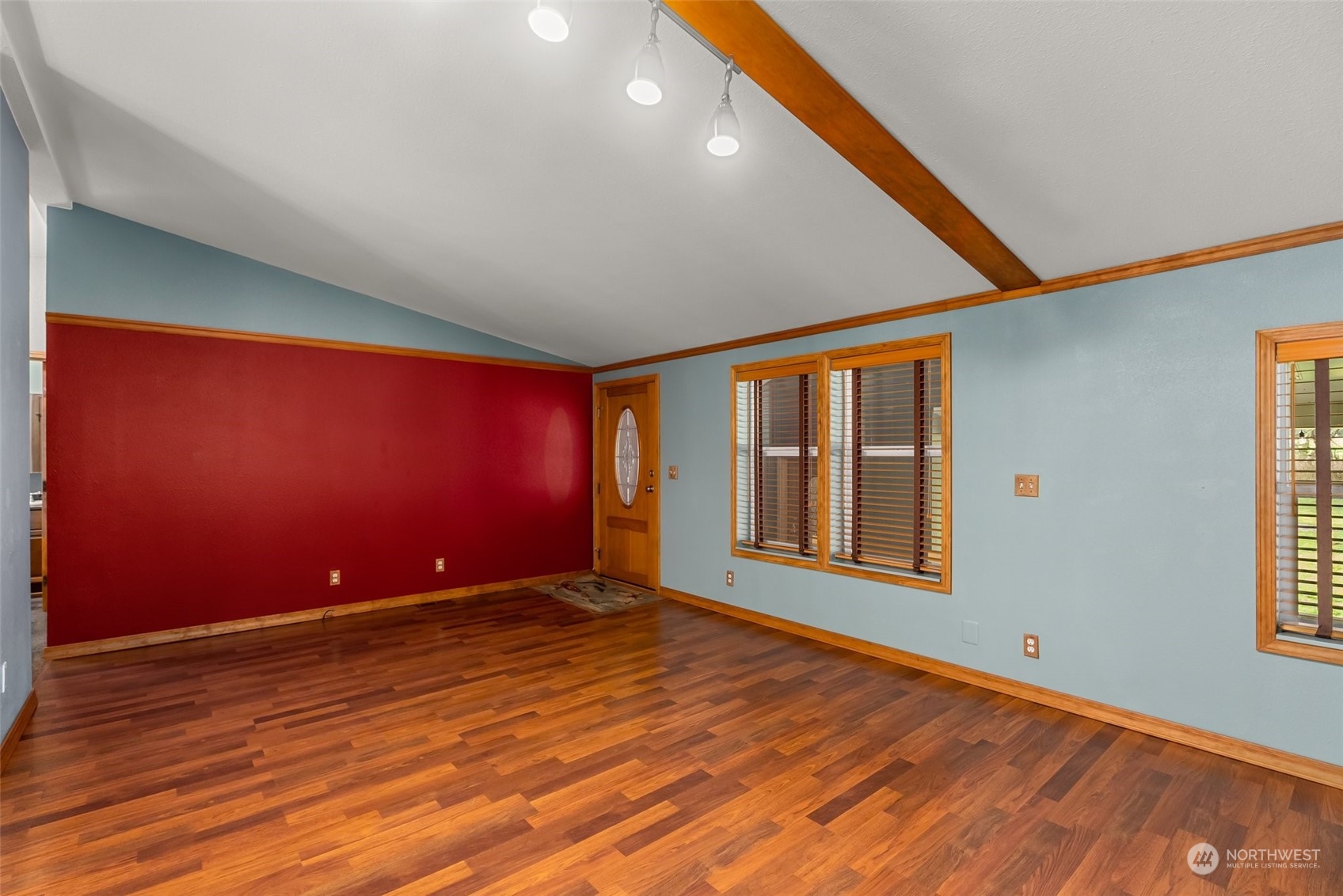 47 Zowadski Road Raymond, WA 98577 - Photo 12 of 40 an empty room with wooden floor and windows