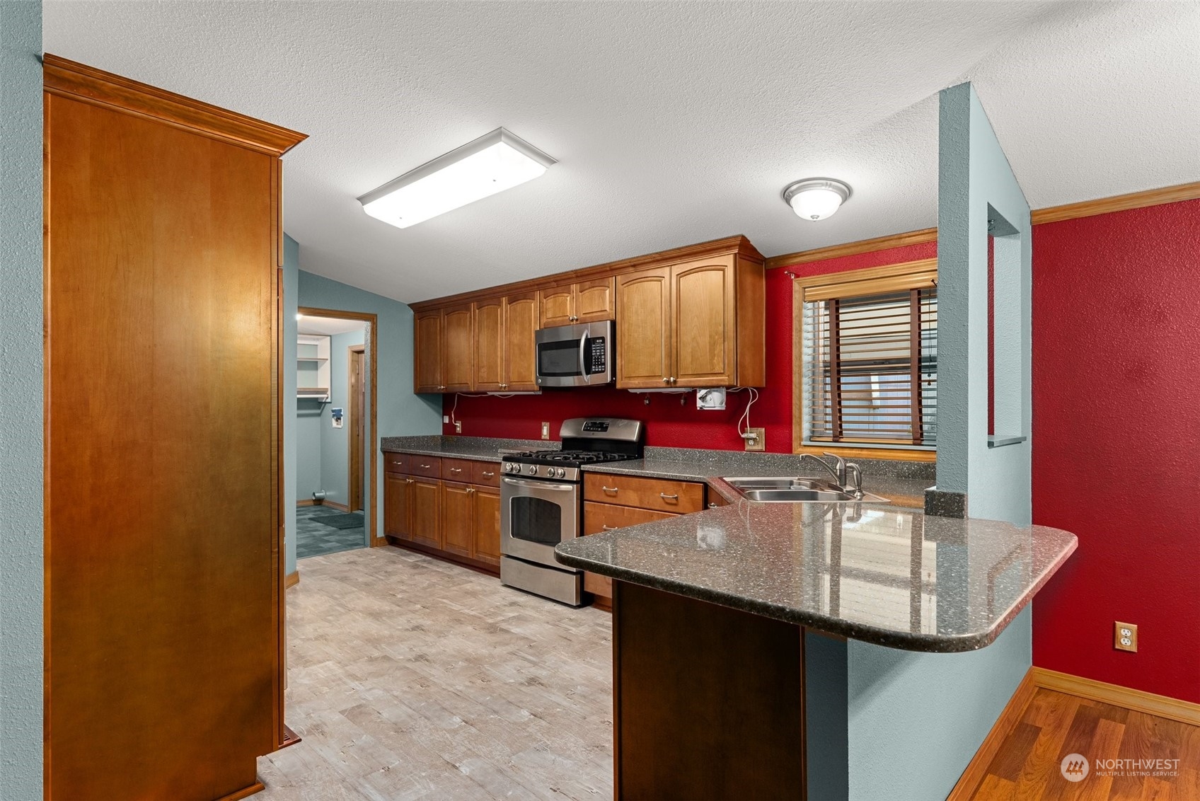 47 Zowadski Road Raymond, WA 98577 - Photo 15 of 40 a kitchen with stainless steel appliances granite countertop a sink stove and refrigerator