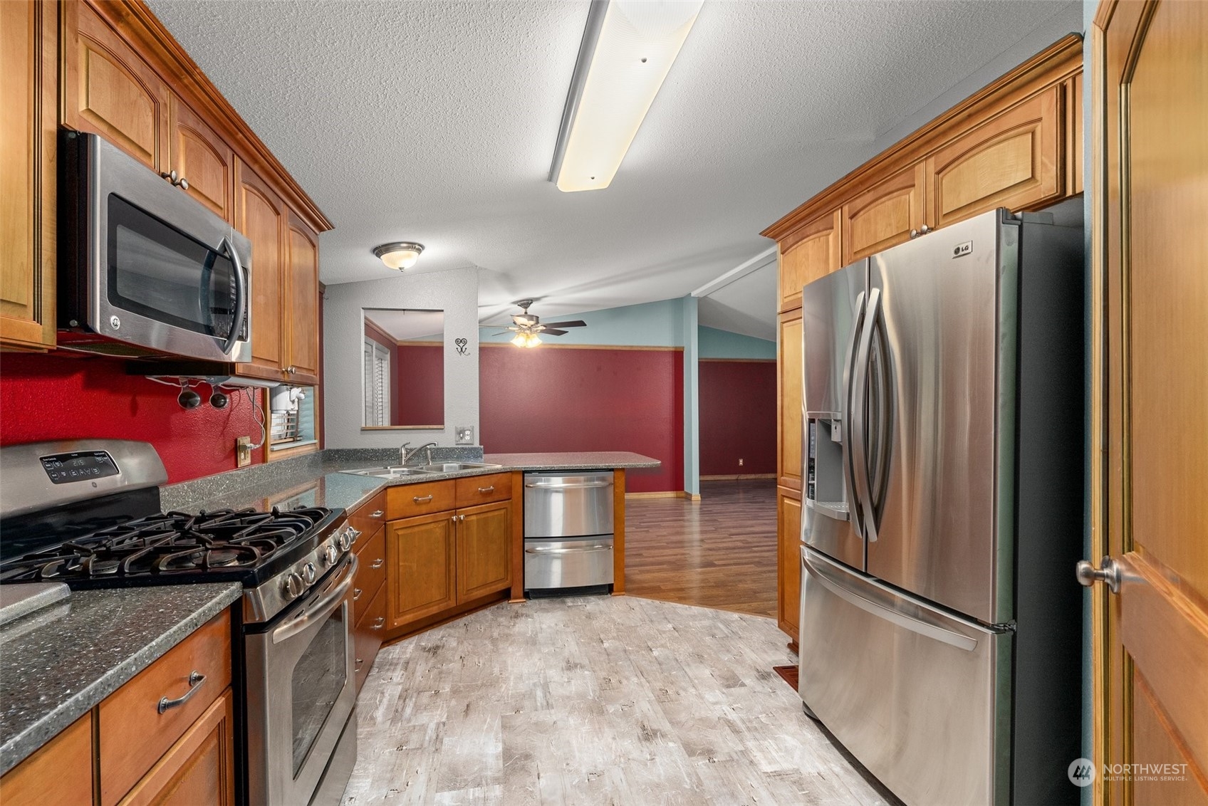 47 Zowadski Road Raymond, WA 98577 - Photo 16 of 40 a kitchen with stainless steel appliances granite countertop a refrigerator stove and sink