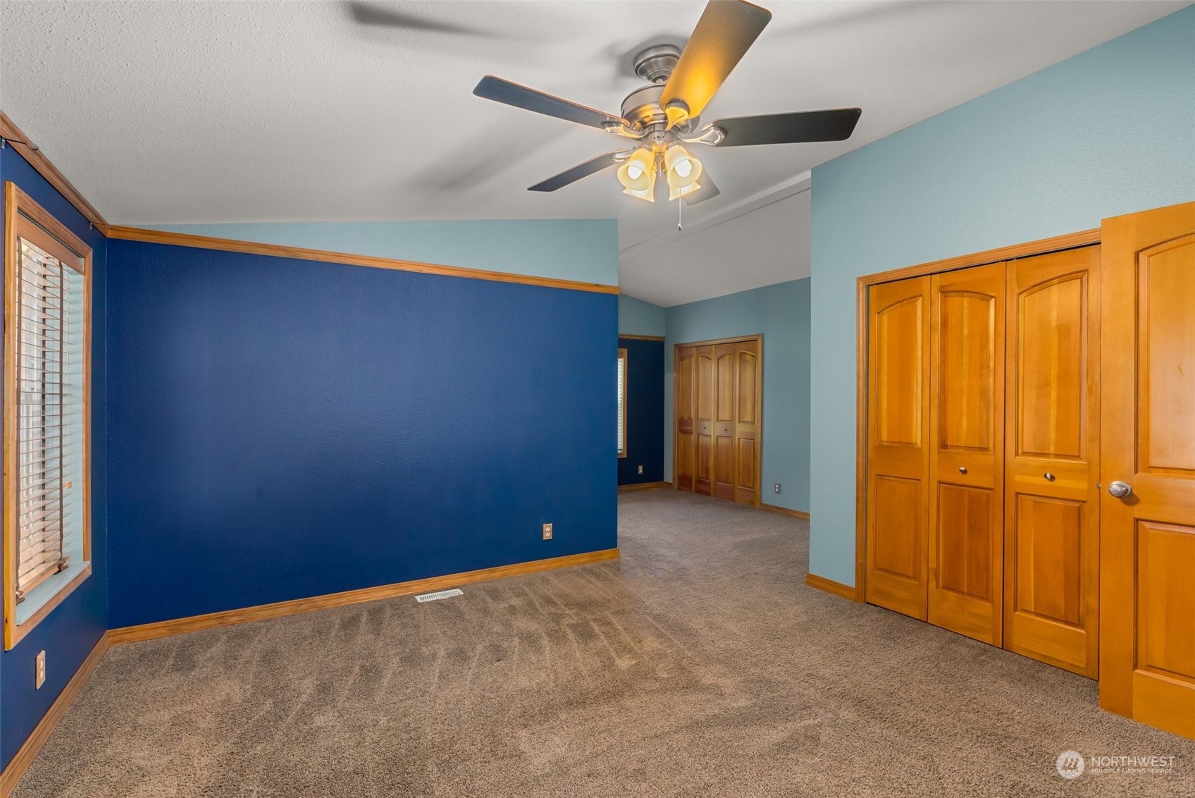 47 Zowadski Road Raymond, WA 98577 - Photo 18 of 40 an empty room with closet and a chandelier fan