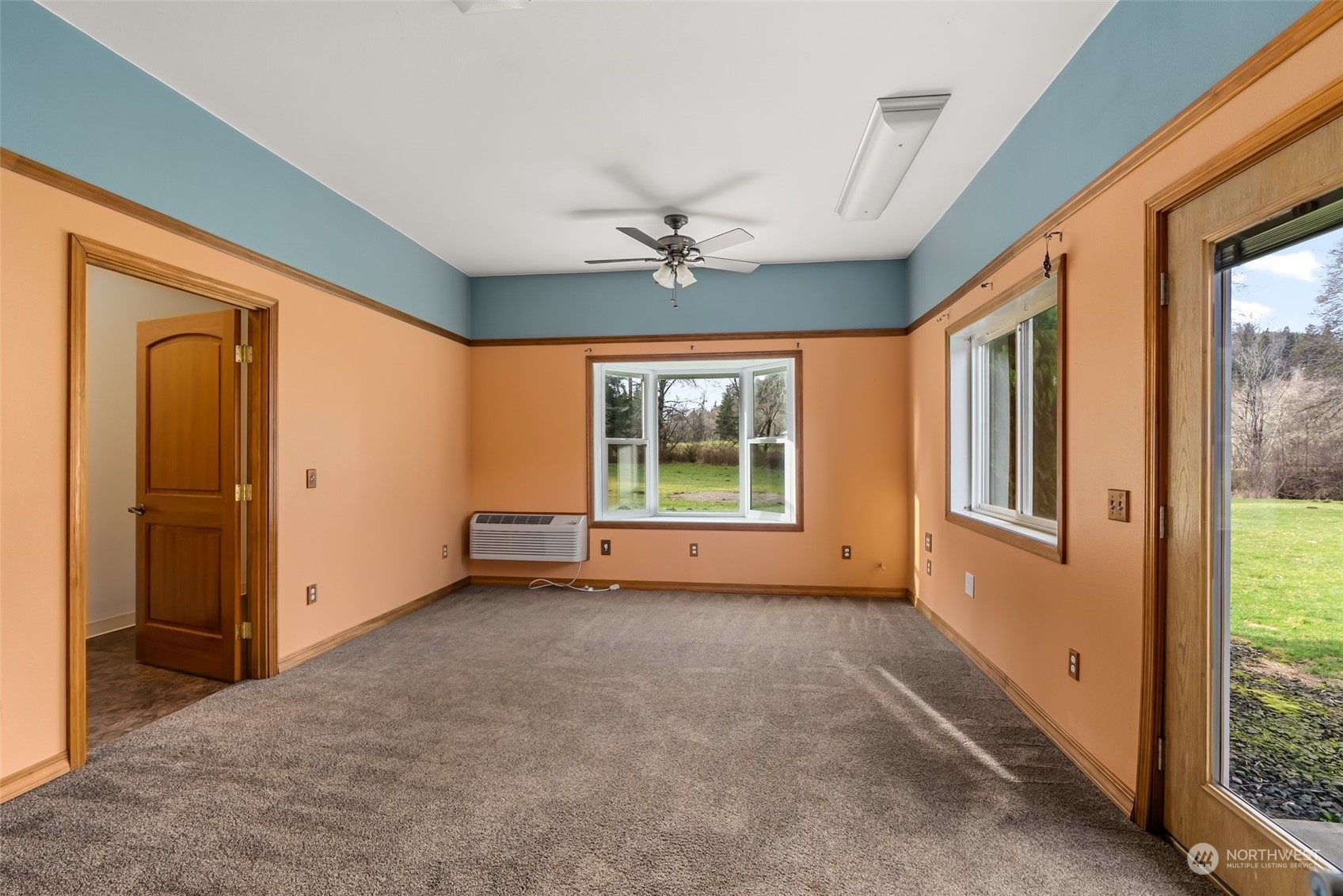 47 Zowadski Road Raymond, WA 98577 - Photo 26 of 40 an empty room with windows and chandelier fan