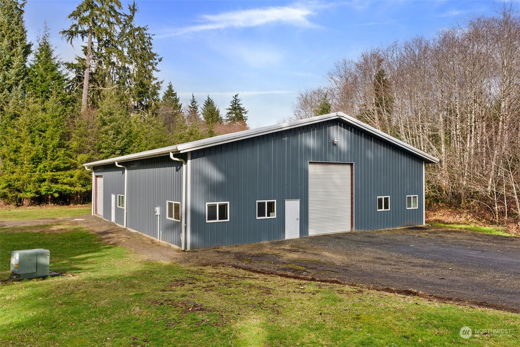 47 Zowadski Road Raymond, WA 98577 - Photo 33 of 40 a view of a house with backyard and trees