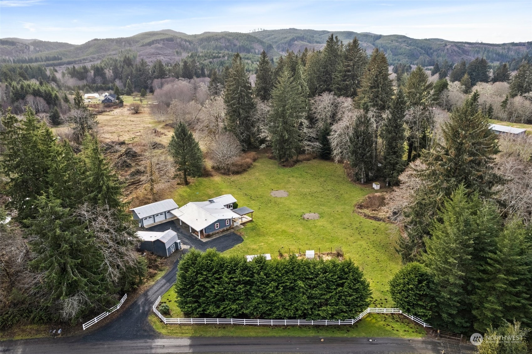 47 Zowadski Road Raymond, WA 98577 - Photo 4 of 40 a view of a lake with mountains in the background