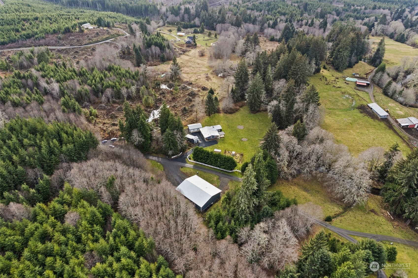 47 Zowadski Road Raymond, WA 98577 - Photo 6 of 40 an aerial view of a house with a yard and lake view