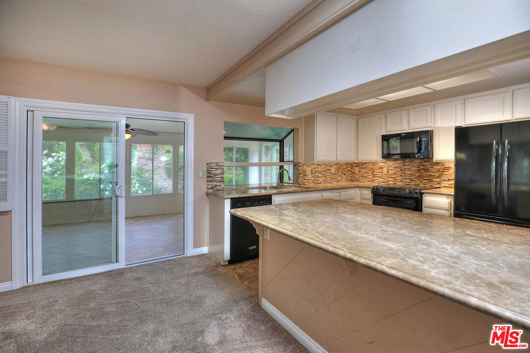 3415 Circle View Drive Simi Valley, CA 93063 - Photo 11 of 37 a kitchen with stainless steel appliances granite countertop a refrigerator and a sink