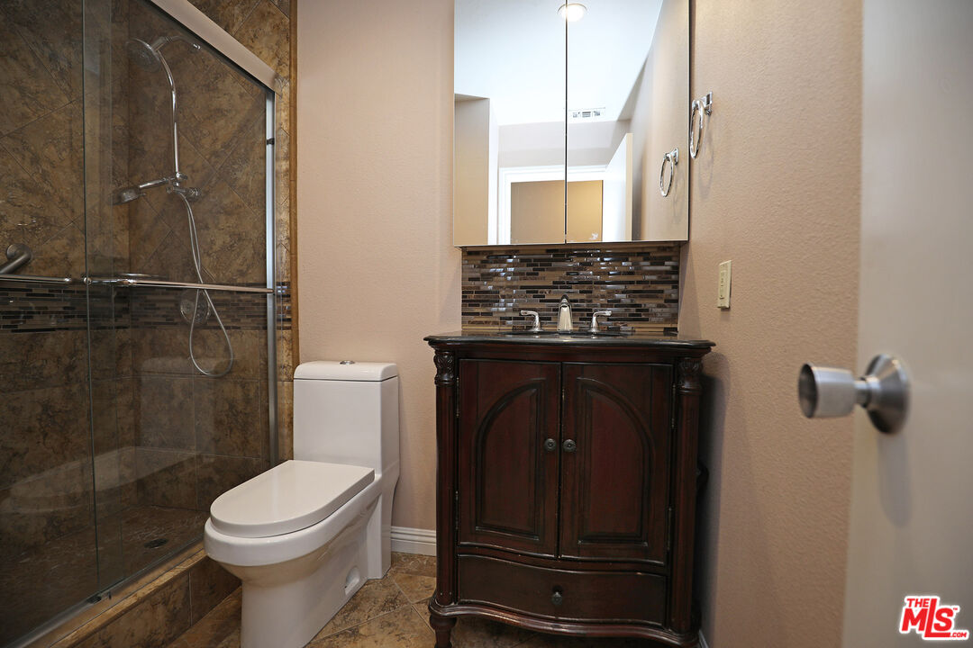3415 Circle View Drive Simi Valley, CA 93063 - Photo 22 of 37 a bathroom with a toilet and a shower