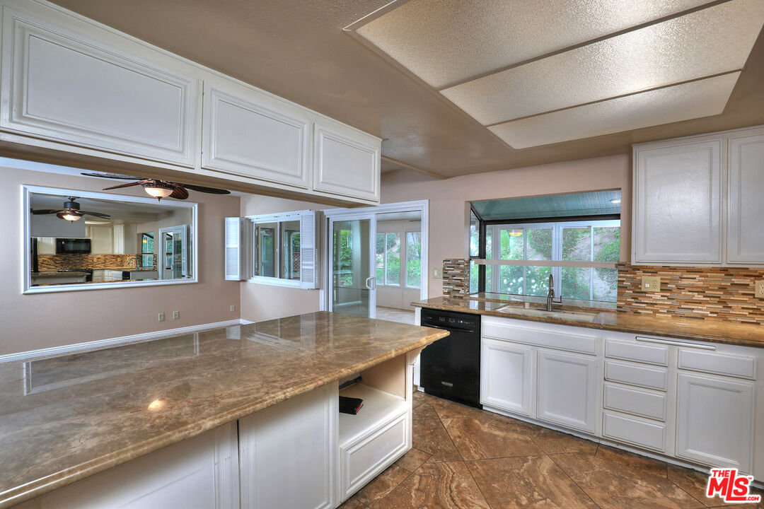 3415 Circle View Drive Simi Valley, CA 93063 - Photo 9 of 37 a kitchen with granite countertop a sink stove and cabinets